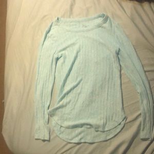 Light blue woolly long sleeve shirt.